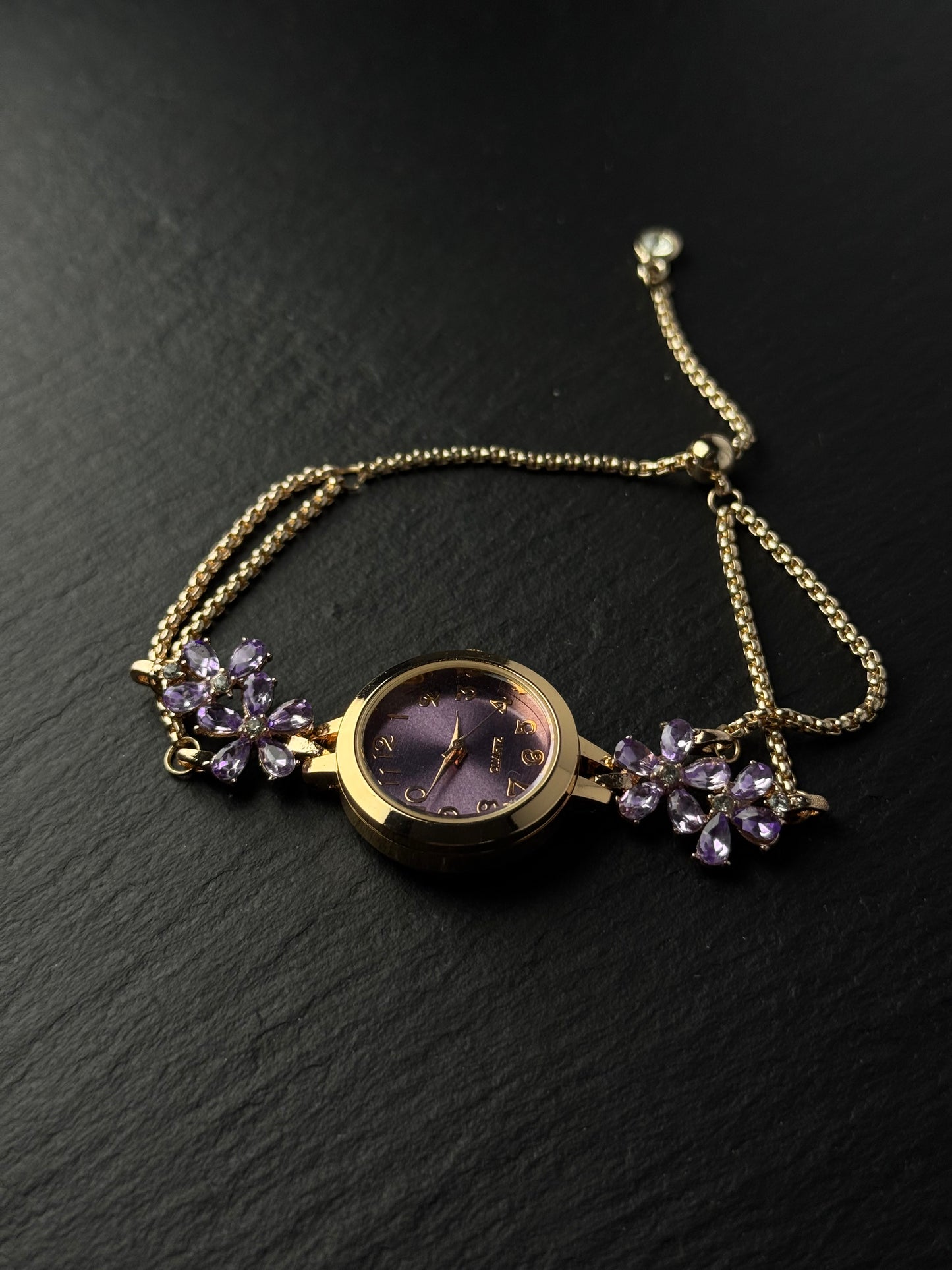 Romantic purple watch bracelet with vintage old-stock styling and floral sparkle