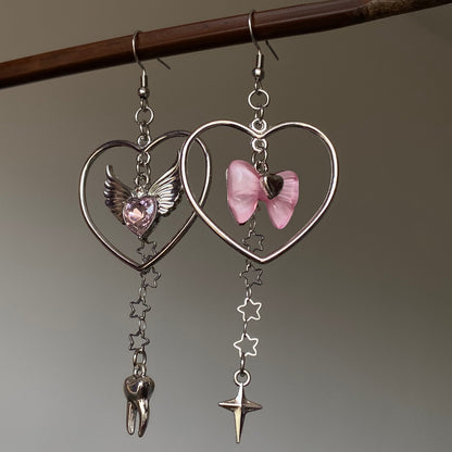 Asymmetrical heart charm earrings with silver-tone open heart frame and pink bow charm