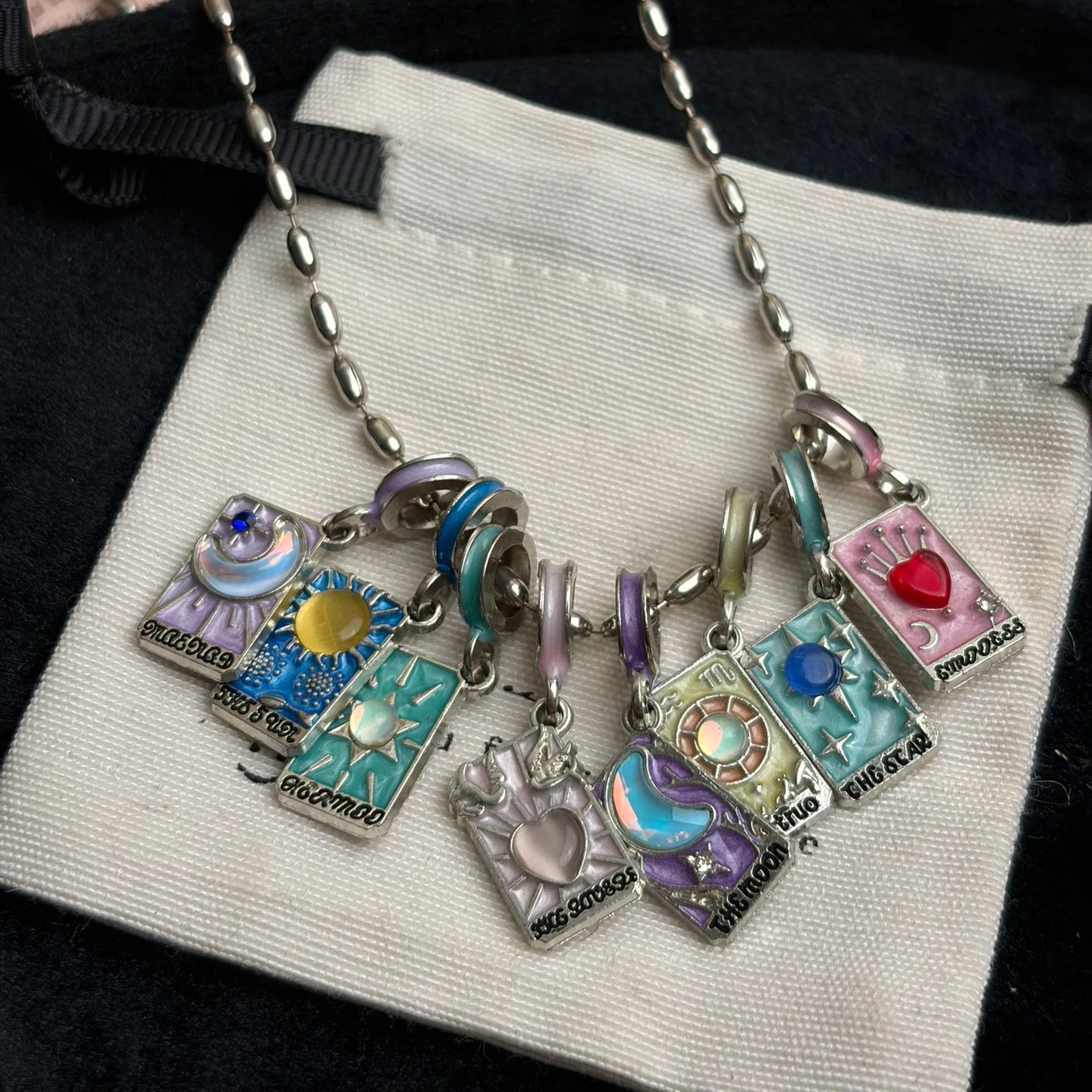 Colorful tarot card charm necklace with silver-tone chain and Y2K styling mood