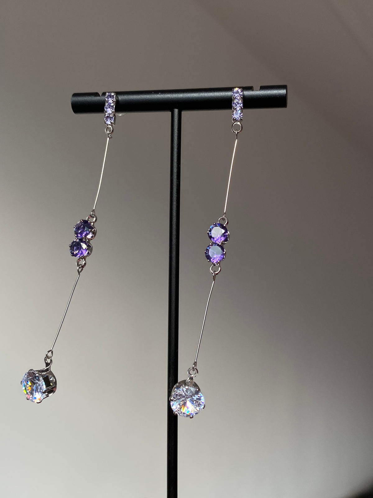 Purple teardrop crystal earrings styled for dreamy Y2K evening jewelry looks