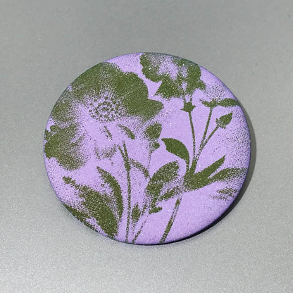Round pocket mirror with lavender purple and moss green vintage artwork