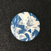 Midnight lily signal pocket mirror with navy background and cream floral print