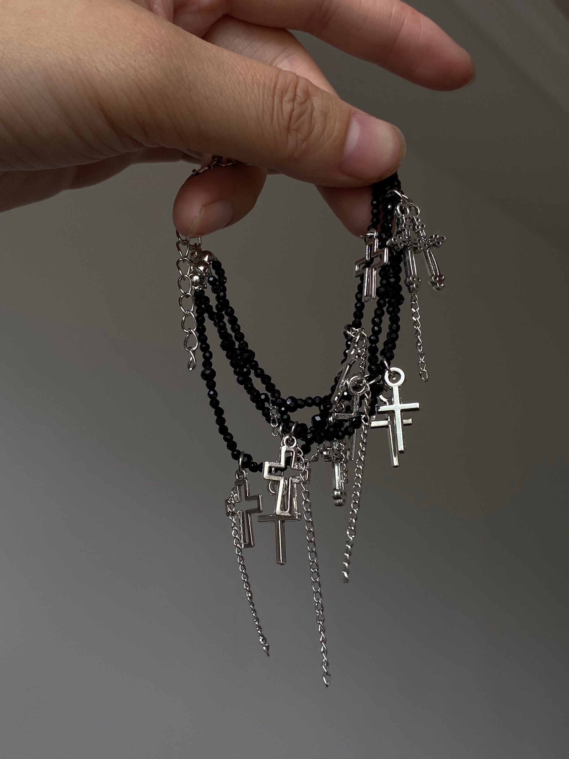 Y2K black beaded bracelet with silver-tone cross charms and layered structure