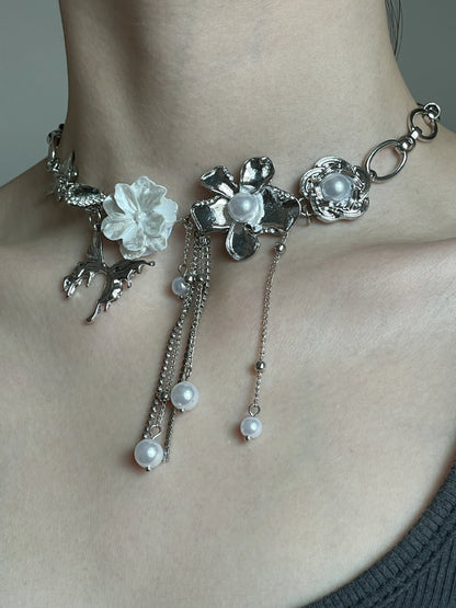 Pearl tassel flower necklace styled as a close-to-neck statement choker