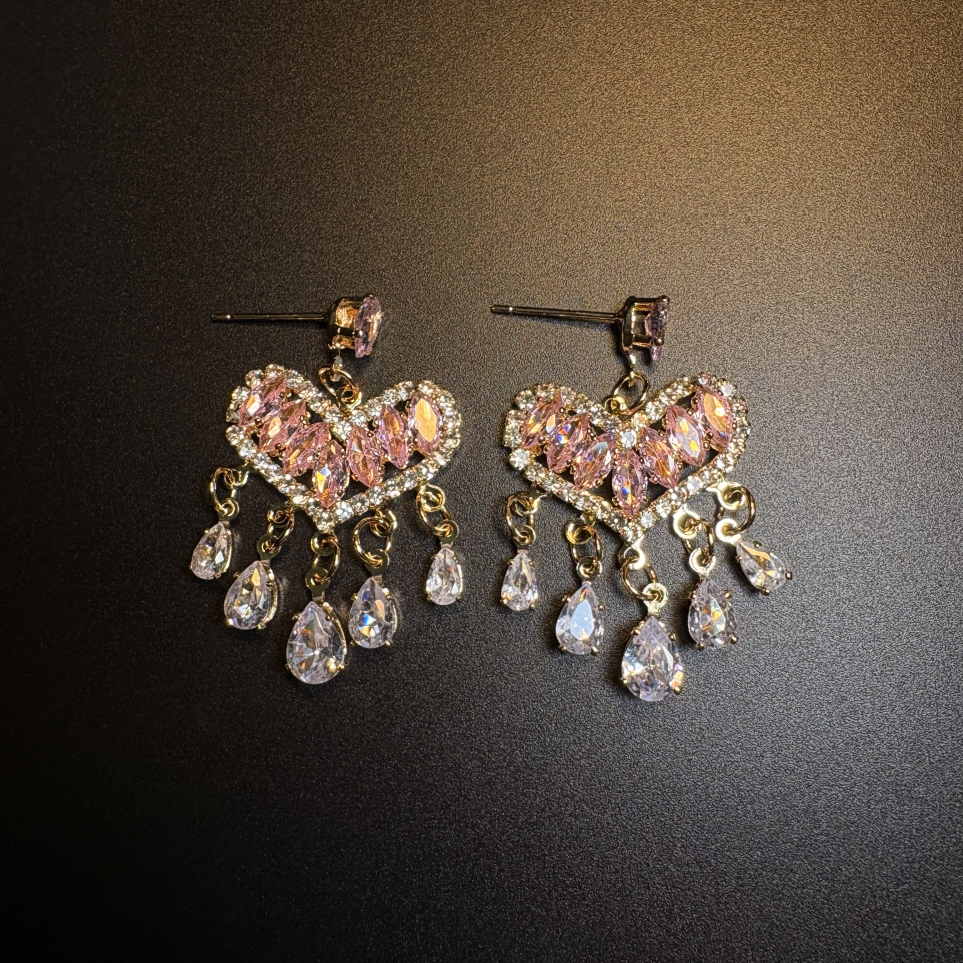 Pink Afterglow Earrings with blush pink zircon heart design and dangling teardrop accents