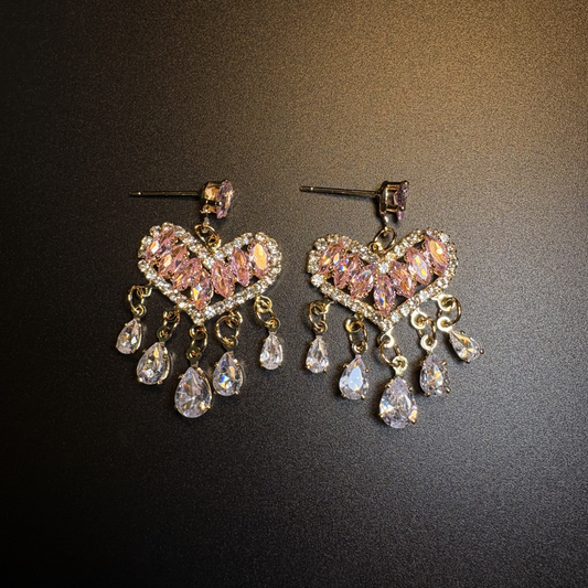 Pink Afterglow Earrings with blush pink zircon heart design and dangling teardrop accents