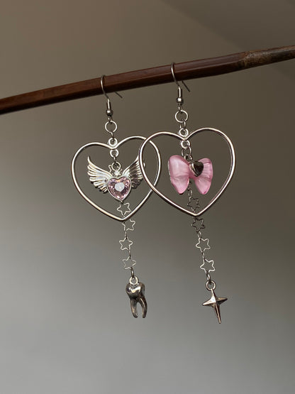 Pink bow heart charm earrings with asymmetrical Y2K dangle silhouette 