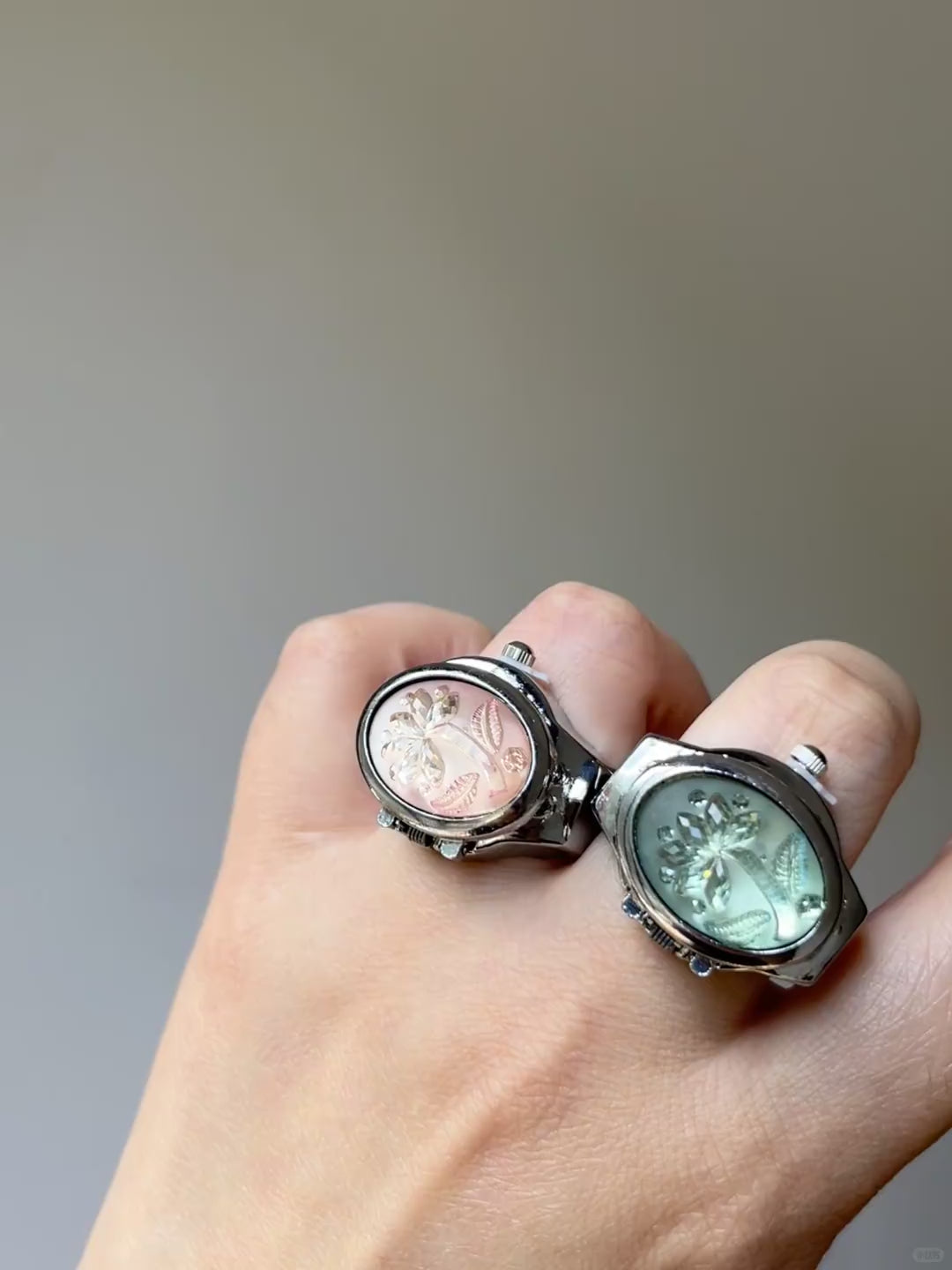 Mint and pink watch ring styles with raised palm tree accents and shiny frame