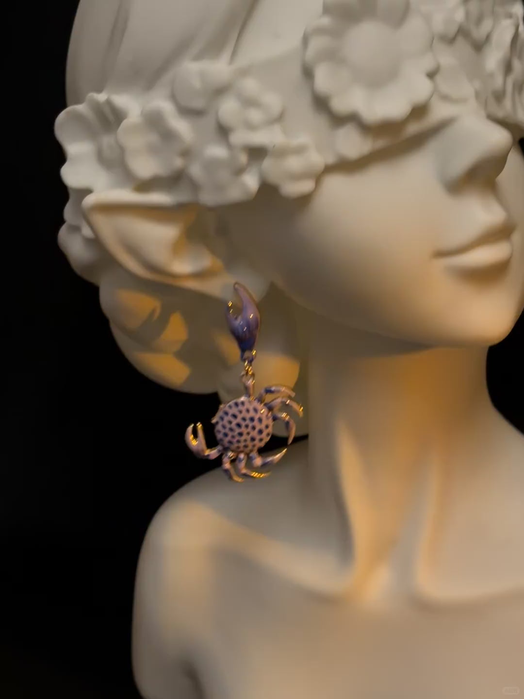 Y2K blue crab earrings with lifted claw shape and coastal styling mood