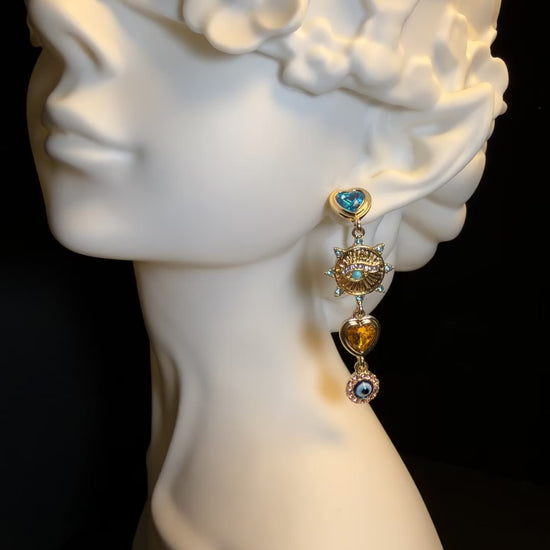 Gold-tone heart charm earrings with colorful rhinestone-style accents