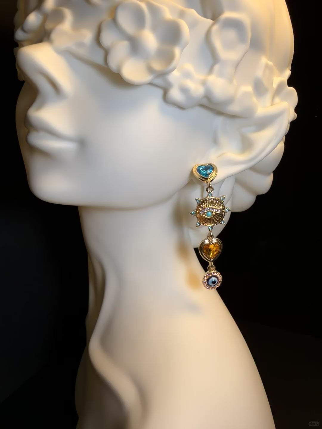 Gold-tone heart charm earrings with colorful rhinestone-style accents
