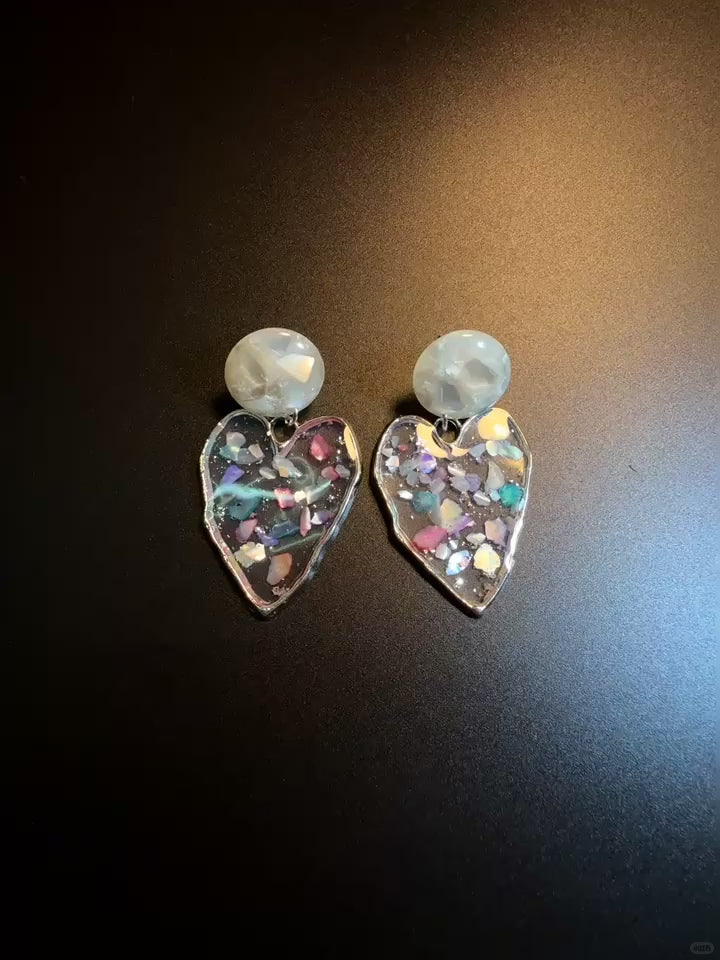 Transparent heart drop earrings with pearly studs and holographic shine