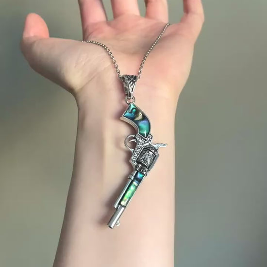 Game relic revolver necklace with shell inlay and vintage statement styling