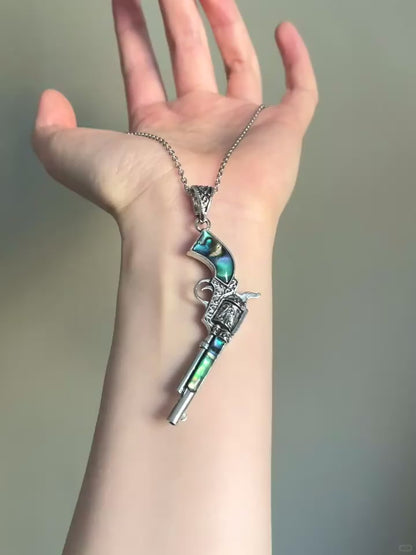 Game relic revolver necklace with shell inlay and vintage statement styling