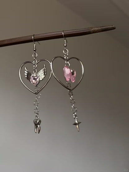 Silver-tone heart dangle earrings with layered charms and dreamcore styling mood