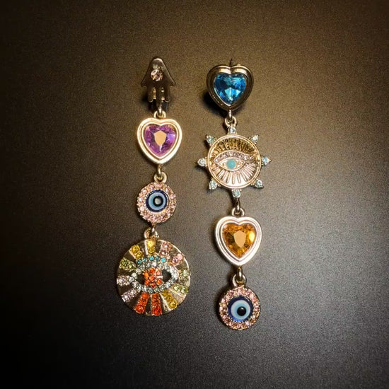 Asymmetrical dangle charm earrings styled for soft grunge and Y2K jewelry looks