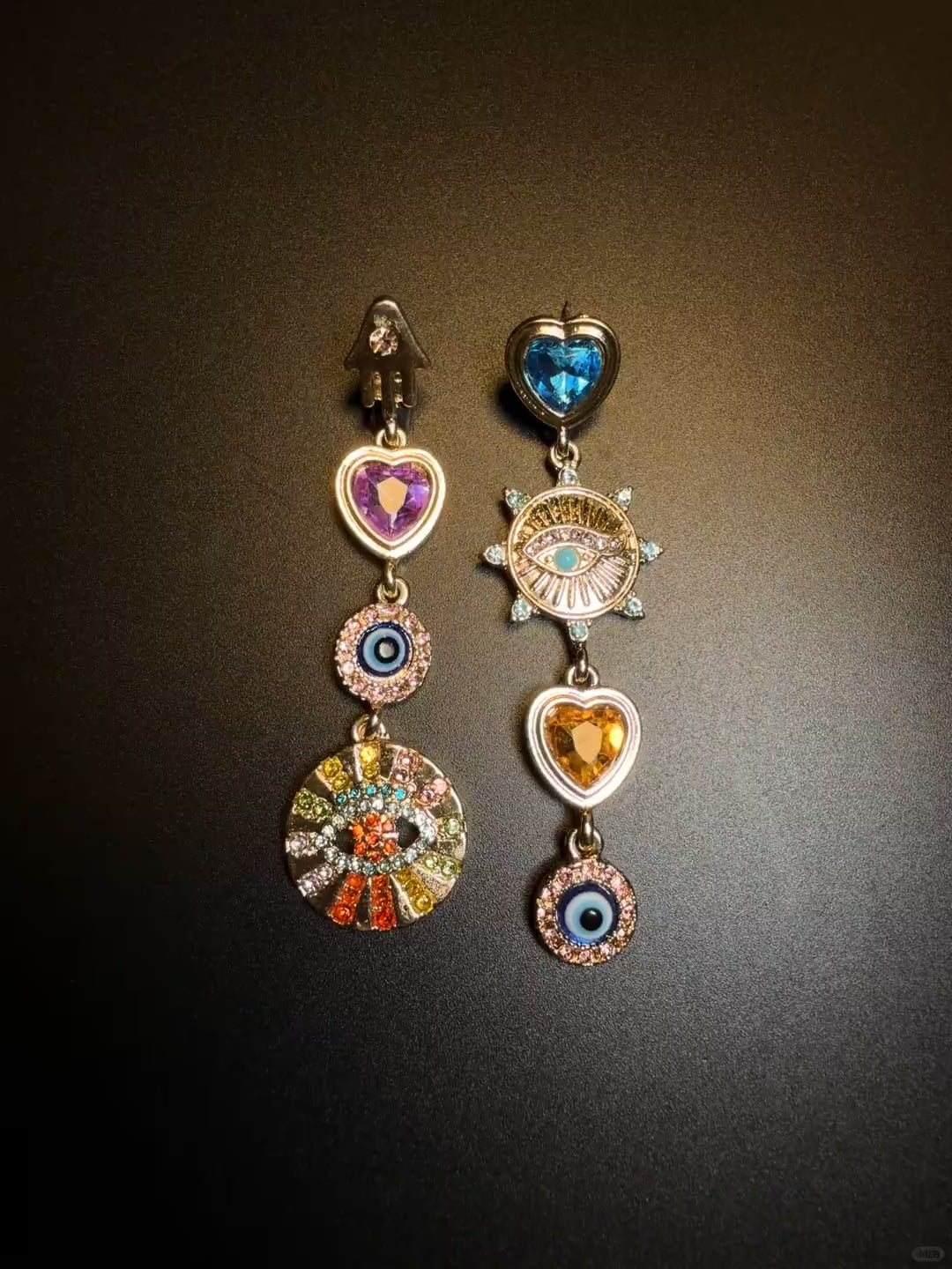 Asymmetrical dangle charm earrings styled for soft grunge and Y2K jewelry looks