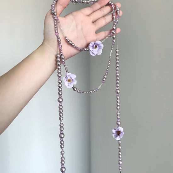 Fairycore purple necklace with floral charms, bead strands, and teardrop ends