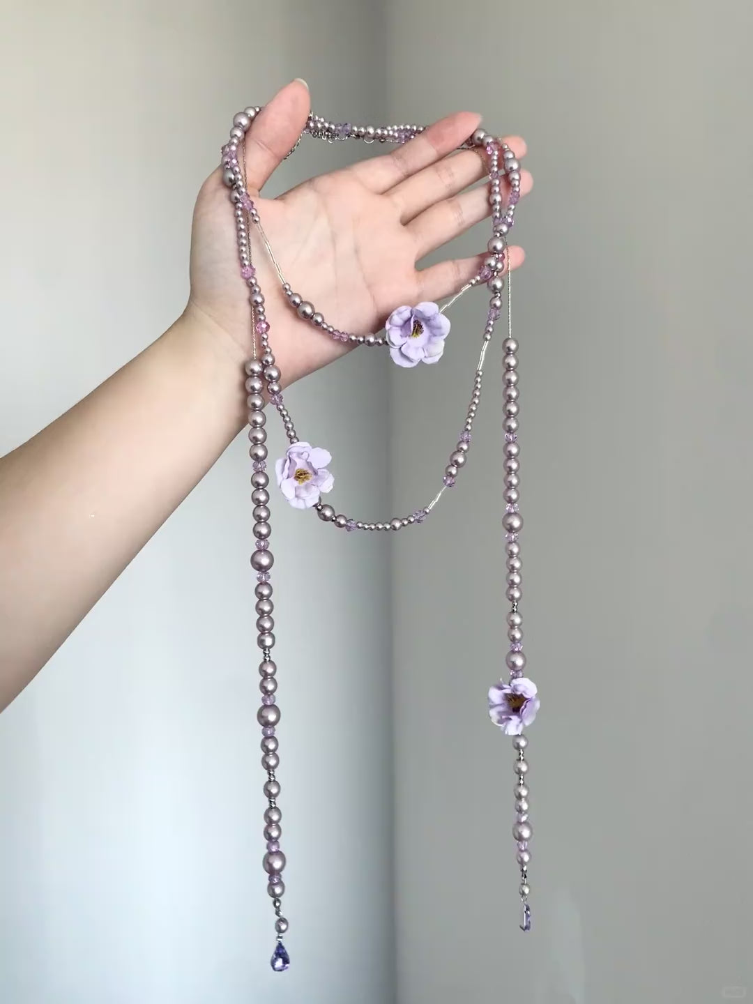 Fairycore purple necklace with floral charms, bead strands, and teardrop ends
