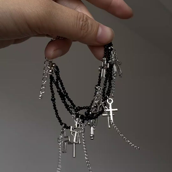 Soft grunge cross bracelet with black bead strands and silver-tone details