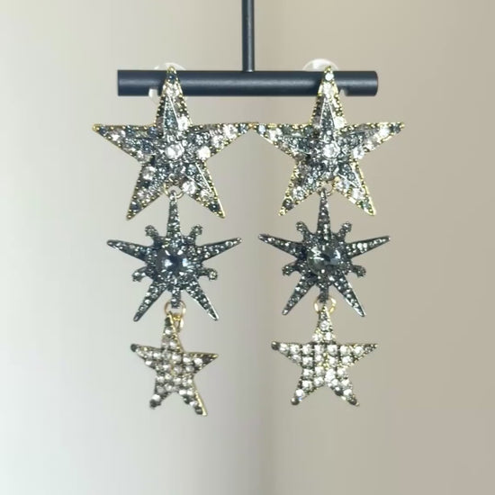 Statement star earrings with clear crystal sparkle and silver-tone metal finish
