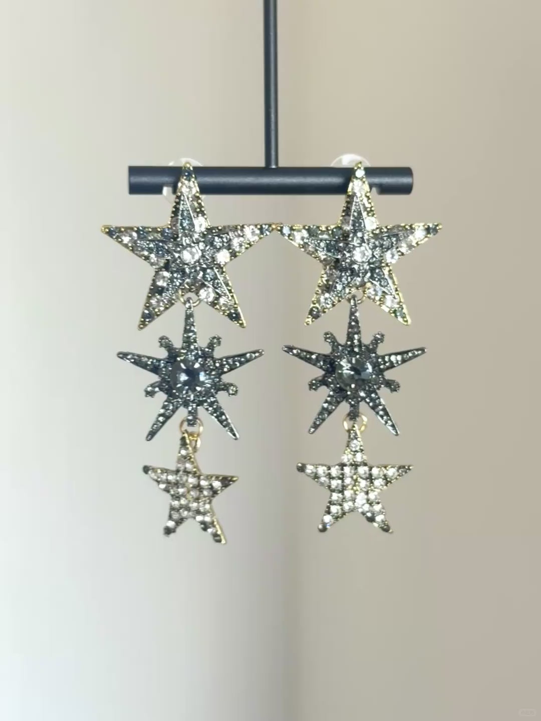 Statement star earrings with clear crystal sparkle and silver-tone metal finish