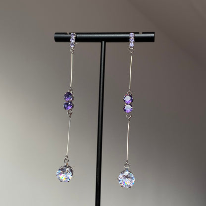 Purple crystal teardrop dangle earrings with silver-tone bar links and clear faceted drops
