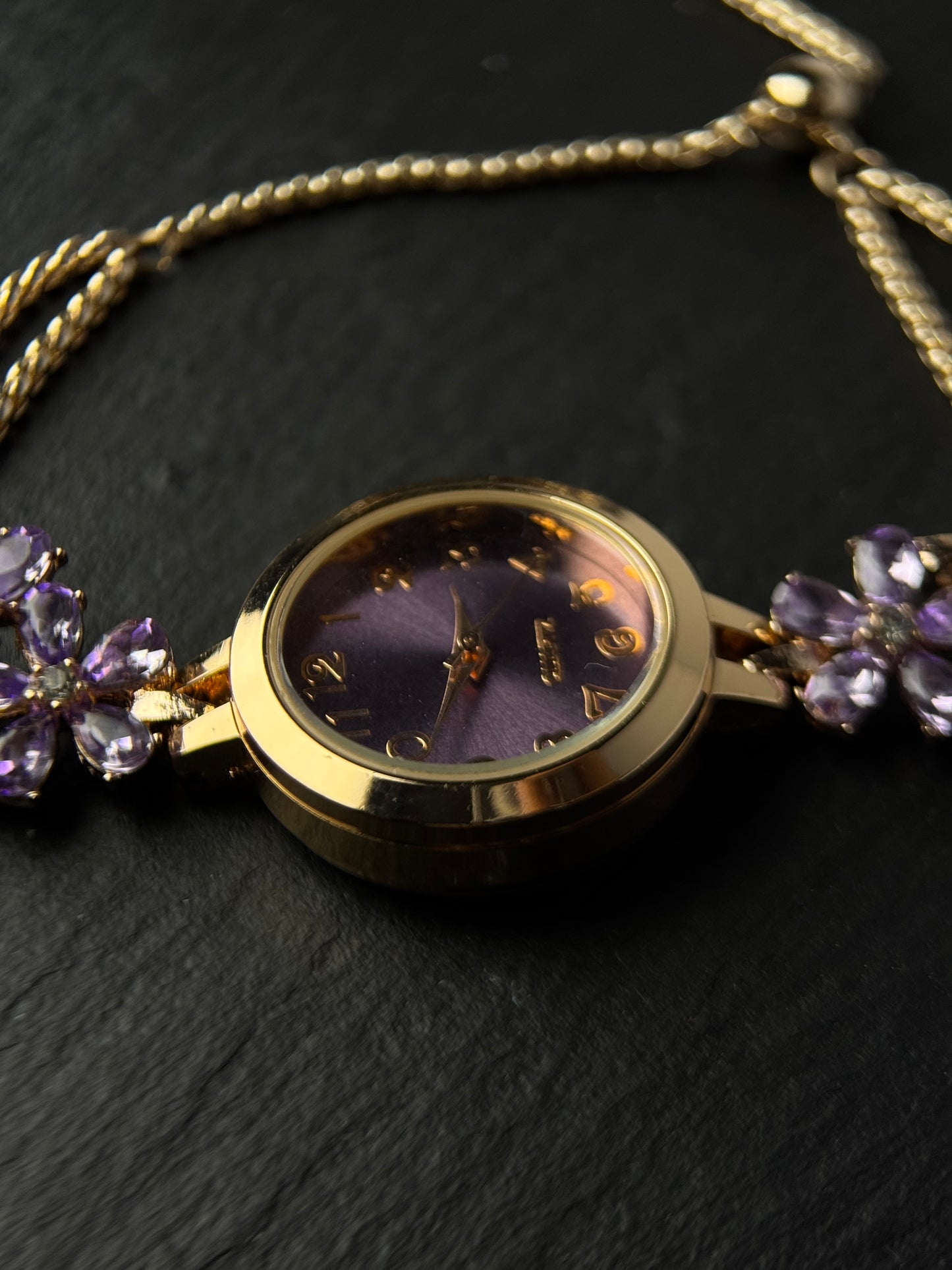 Vintage purple watch bracelet with round dial and sparkling flower details