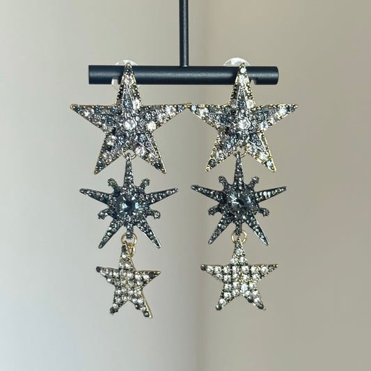 Rhinestone star dangle earrings with silver-tone setting and layered crystal stars