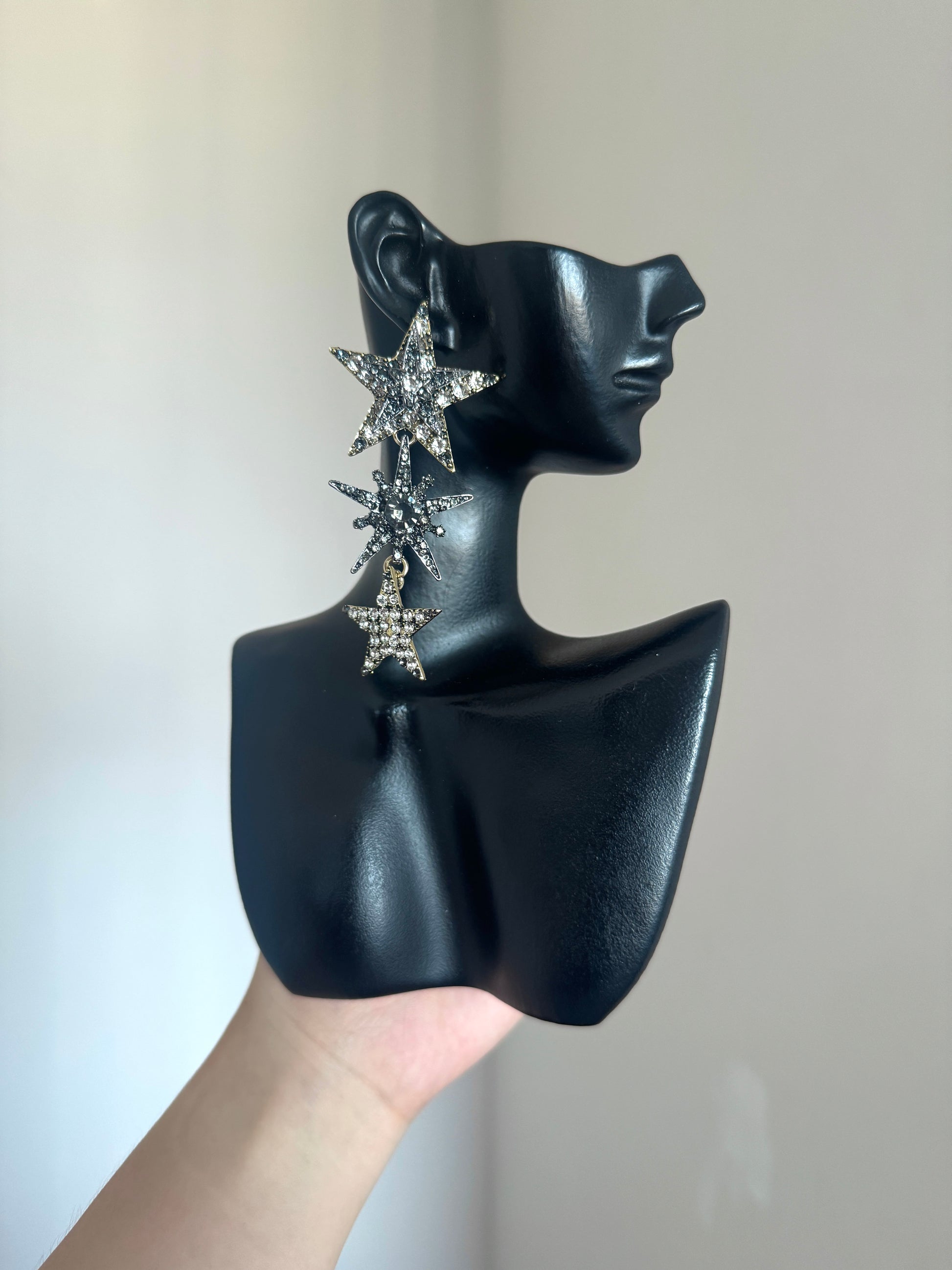 Y2K star dangle earrings with large top star, starburst charm, and lower star drop