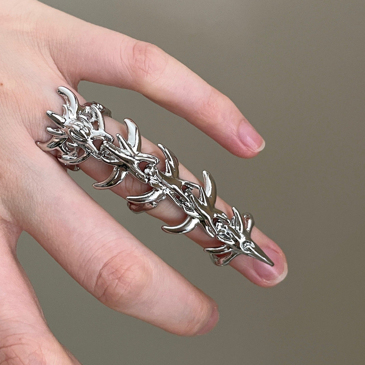 Silver thorn armor ring with long full-finger silhouette and claw-like details