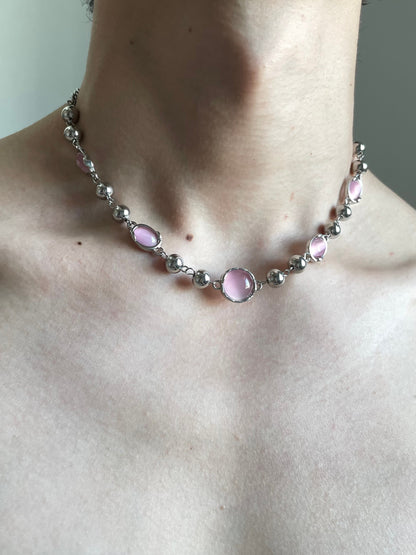 Y2K pink cat eye bead necklace styled as a close-to-neck choker