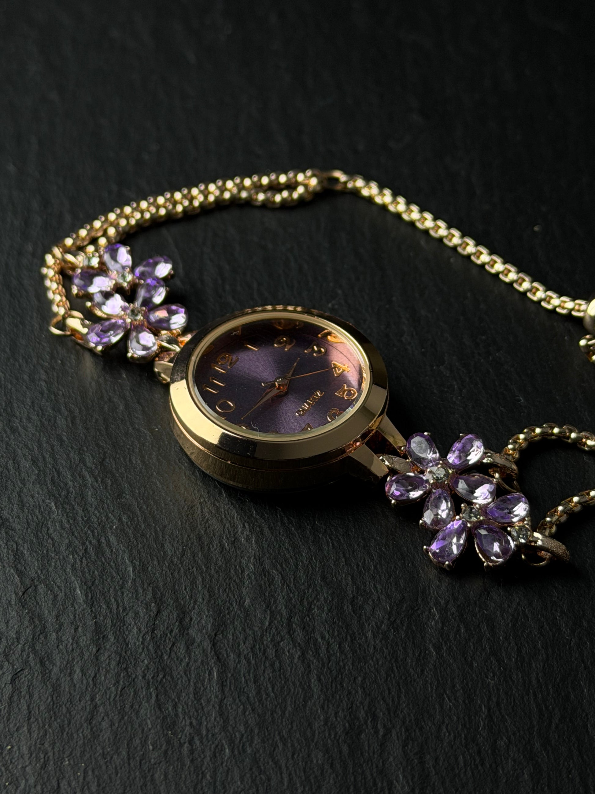 Purple crystal flower watch with rose gold-tone finish and chain-style bracelet