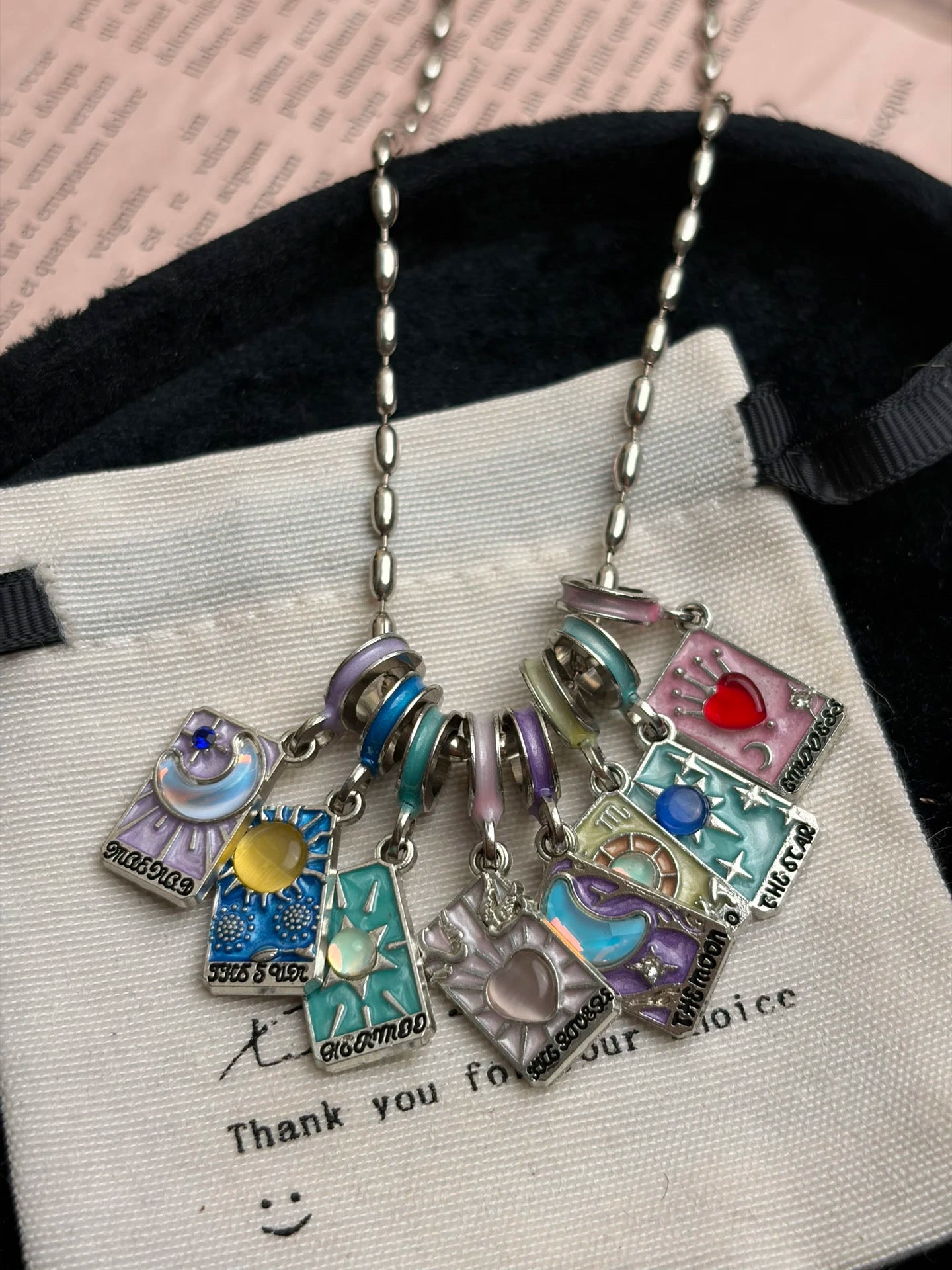 Mixable mini card pendant necklace with colorful charms and playful symbols